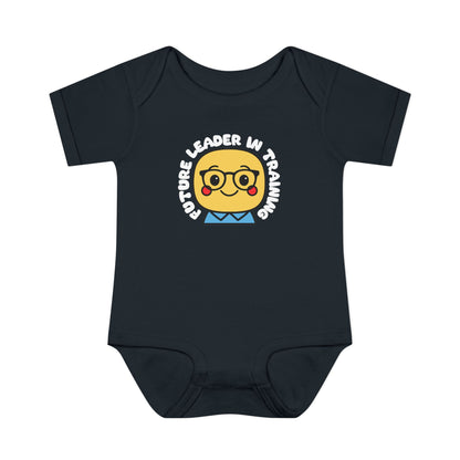 Black baby onesie with a cartoon face and 'Future Leader in Training' text on a white background